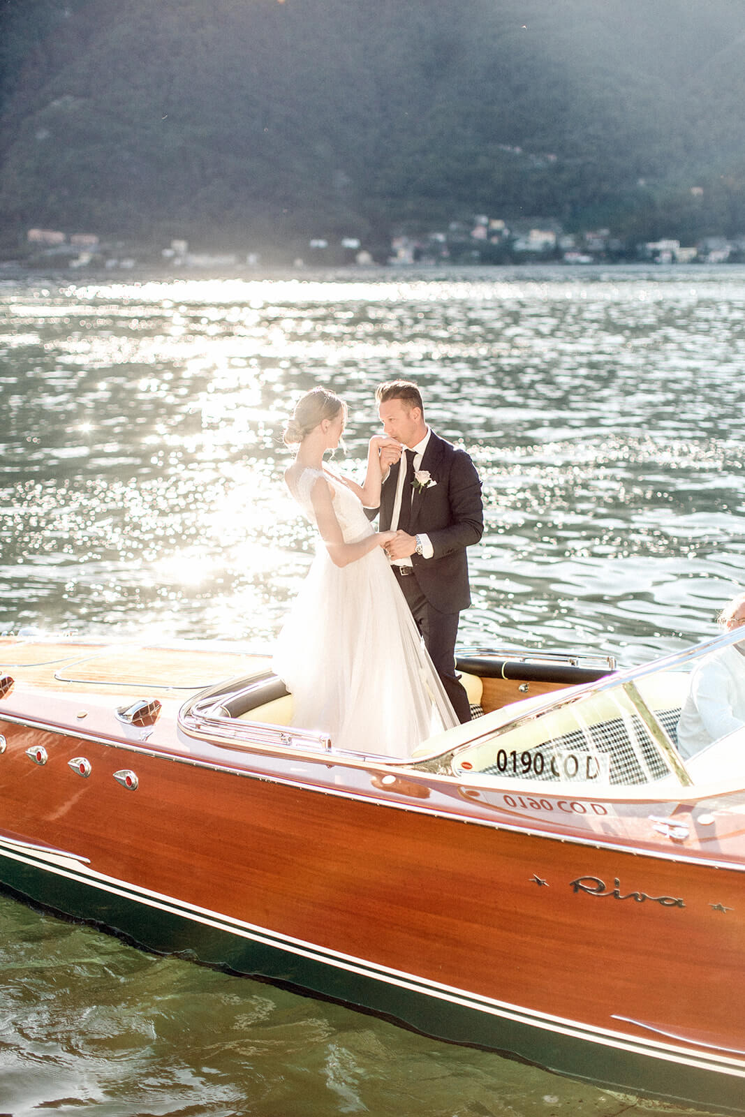 Lake como newlyweds on boat